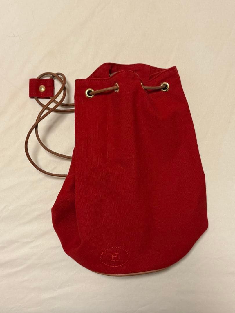 エルメス 赤 キャンバス ドローストリングショルダーバック
