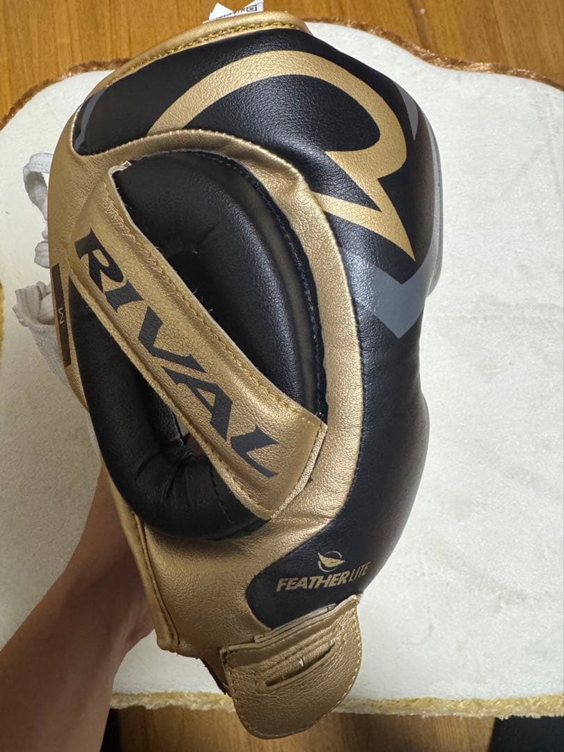 RIVAL 100シリーズ ヘッドギア M ゴールド/ブラック