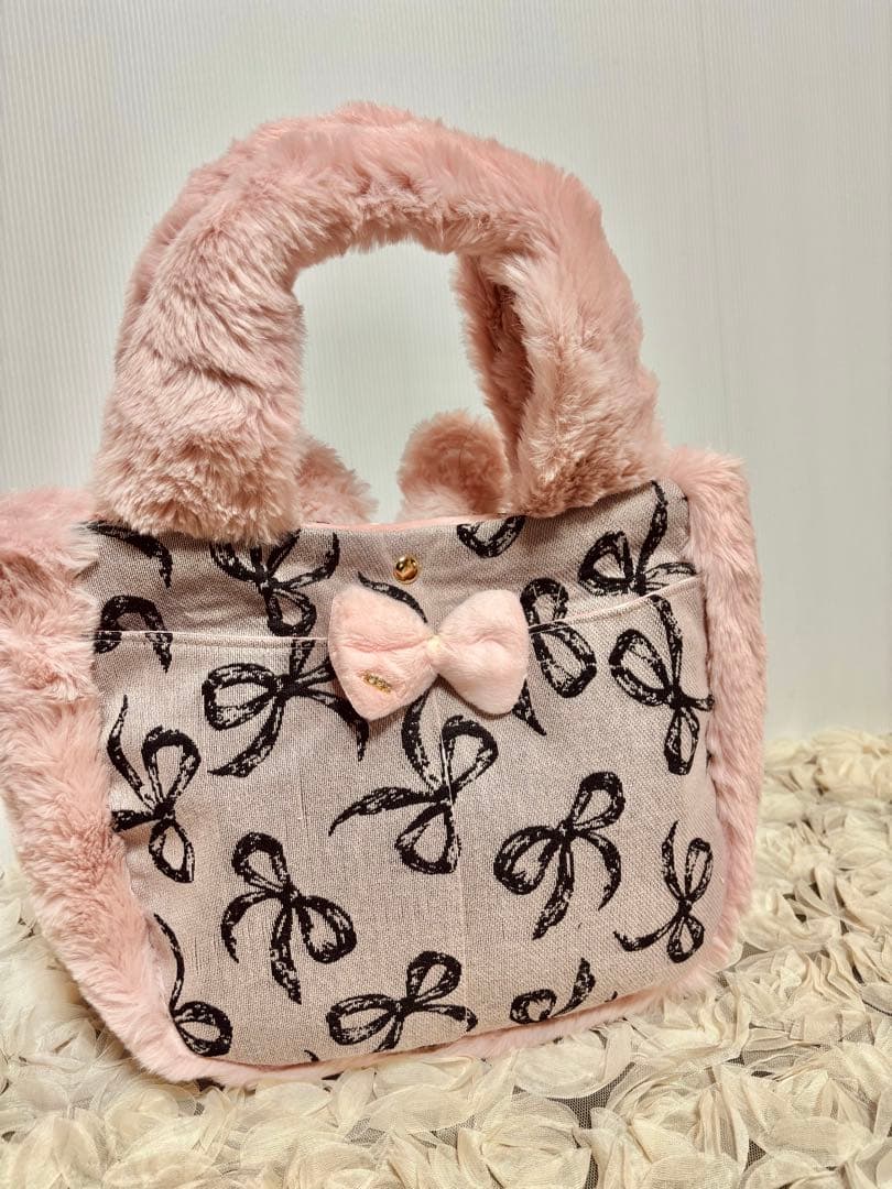 お取り置きです。コヤンイサムチョン　ピンクファのリボンゴブランころりんバッグ