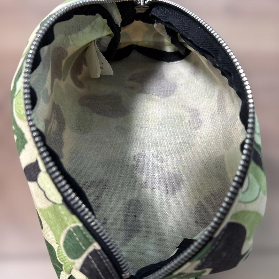 ベイシングエイプ✖️カウズカモフラ柄ポーチAPE ✖️KAWS NIGO